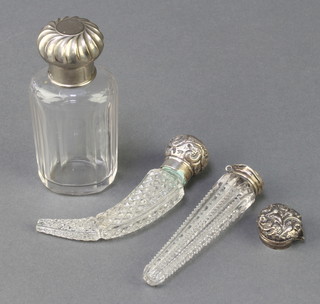 An Edwardian silver mounted cut glass scent bottle and 2 others
