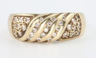 A 14ct gold diamond swirl ring, size P