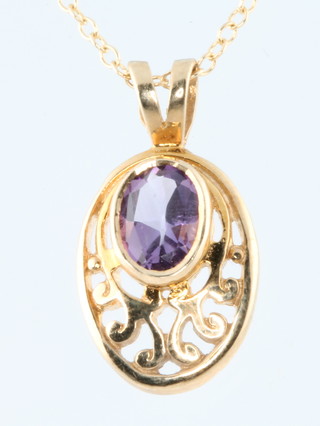 A 9ct yellow gold amethyst set pendant on a ditto chain, gross 4 grams