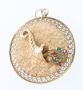 A 14ct yellow gold gem set cornucopia pendant, 10 grams
