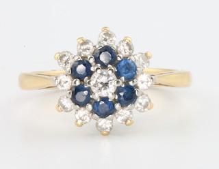 An 18ct yellow gold sapphire and diamond cluster ring, size J 1/2