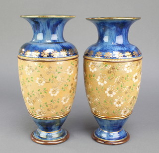 A pair of Royal Doulton oviform vases, the blue ground with wide band of flowers 7205, 11" 