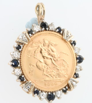 A 2000 half sovereign in a gem set 9ct gold 4 gram mount