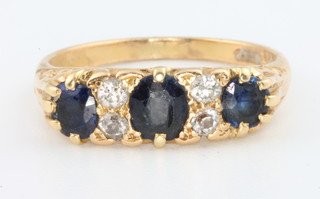 An 18ct yellow gold sapphire and diamond ring, size P 