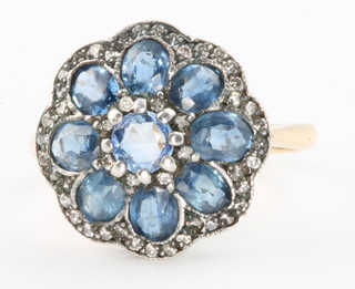 A yellow gold Edwardian style sapphire and diamond cluster ring, size L 1/2 