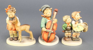 3 Hummel figures - boy cello player 186 5", girl and boy with basket 493/0 4 1/2" and friends 1947 5" 