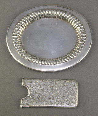 A Victorian silver card case with chased scroll decoration Birmingham 1898 together with an Edwardian oval silver dish Sheffield 1905 114 grams 