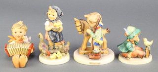 4 Hummel figures - boy with flute and bird 63 3", boy with concertina and bird 3", girl with chicken and chicks 199/0 4 3/4" and child with rocking horse 20 4 1/2" 