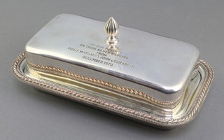 A rectangular silver plated butter dish with glass liner and inscription 