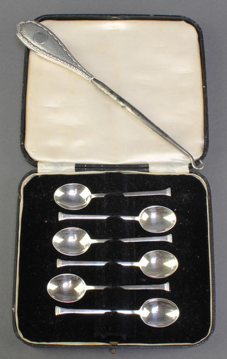 A cased set of 6 silver coffee spoons Sheffield 1937 62 grams and a silver handled button hook 