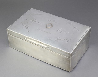 A rectangular silver engine turned cigar/cigarette box with monogram and engraved signatures, London 1926, 9" 