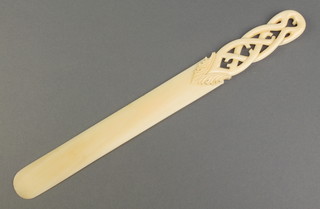 A Victorian carved ivory page turner with pierced handle 11 1/2" 