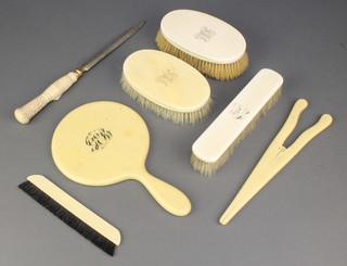 A pair of gentleman's ivory backed hairbrushes, clothes brush, mirror 3 other items 