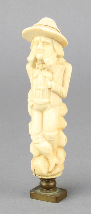 A 19th century Continental carved ivory seal in the form of a standing gentleman 5" 