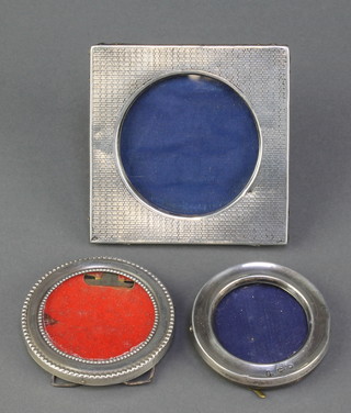 An Edwardian silver engine turned square photograph frame 3", 2 circular ditto 