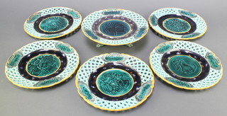 A Wedgwood 6 piece Majolica ribbon ware fruit service comprising circular pedestal comport raised on hoof feet 9" (cracked) and 5 circular plates 9" (all cracked), the base impressed Wedgwood EWE 