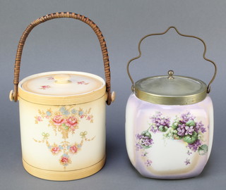 An Edwardian blush ivory biscuit barrel and cover with floral decoration 5 1/2", a purple glazed and floral patterned biscuit barrel with plated mounts 6" 
