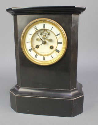 A Victorian 8 day striking mantel clock with enamelled dial, Roman numerals and visible escapement contained in a black marble case, the dial signed Philibert Paris 