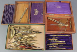 2 19th Century geometry set cases together with 4 protractors and numerous geometry instruments