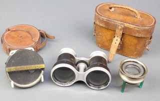 A Watkins clinometer/compass marked J Hicks of 8 Hatton Gardens, a pocket sextant 2" contained in a circular leather case, a small table top magnifying glass and a pair of opera glasses in a leather case 