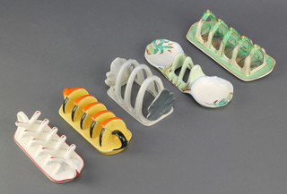 A Carlton Ware Art Deco 5 bar toast rack of angular form 6 1/2", a Shelley ditto 8", a Clarice Cliff ditto with floral decoration 8 1/4", a Crown Devon Fieldings ditto 7" and a Carltonware leaf decorated ditto 5" 