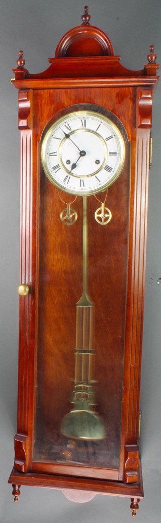A Vienna style striking regulator with 7" enamelled dial, Roman numerals, grid iron pendulum contained in a mahogany case 