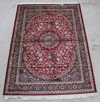 A red and gold ground Belgian cotton Keshan style carpet with central medallion 91" x 63" 