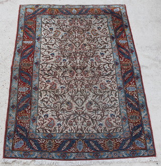 A white, tan and turquoise ground Persian Qum rug with floral ground 80" x 54", some wear 