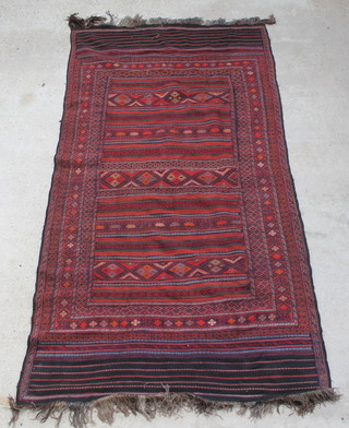 A red and blue ground Kilim rug 117" x 62" 