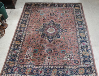 A Persian tan ground Tabriz carpet with central medallion 150" x 118", signed, some wear and moth to the edges 
