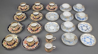 An 18th Century German porcelain part coffee set comprising 11 coffee cans and 9 saucers, the blue and gilt ground with floral decoration together with 2 Japanese part tea sets with gilt and floral decoration 