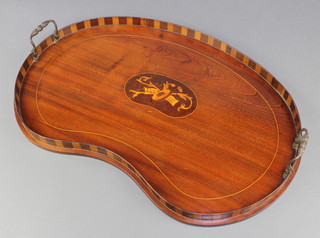 An Edwardian kidney shaped inlaid mahogany twin handled tea tray, the centre inlaid musical trophies 22"h x 14 1/2"w