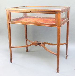 An Edwardian crossbanded and inlaid rectangular bijouterie table, raised on square tapered legs 29"h x 27" x 17 1/2"d 