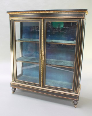 A Victorian ebonised display cabinet with gilt metal mounts and inlay, fitted 3 shelves, raised on turned feet with brass casters 48"h x 41"w x 14"d 