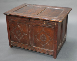 An 18th Century oak coffer of panelled construction with hinged lid 22"h x 33"w x 23 1/2"d 