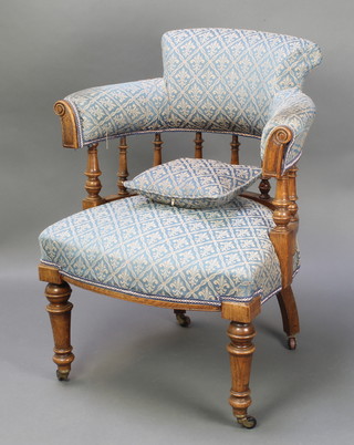 A Victorian oak tub back chair with bobbin turned decoration and upholstered seat and back, raised on turned supports (frame loose)
