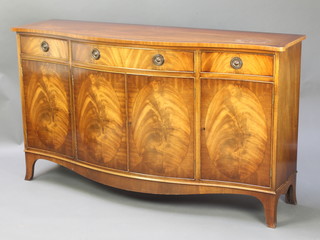 A Georgian style sideboard of serpentine outline with crossbanded top fitted 1 long drawer flanked by 2 short drawers with triple cupboard below, raised on splayed bracket feet 34"h x 59"w x 18"d 