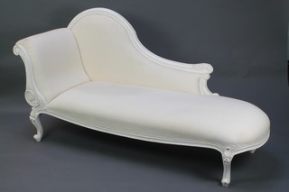 A Victorian style white painted show frame chaise longue upholstered in white striped material 38"h x 73"l x 25"d 