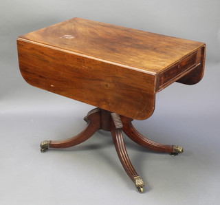 A Georgian mahogany pedestal Pembroke table fitted a drawer, raised on a turned column and tripod base 28"h x 36"w x 19 1/2" when closed x 39" when open 