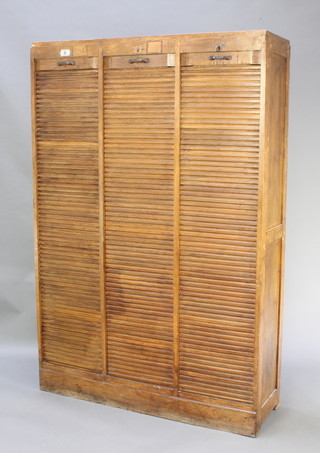 An Art Nouveau French oak filing cabinet enclosed by tambour shutters, The Meubles Abbey 71"h x 48"w x 14 1/2"d 