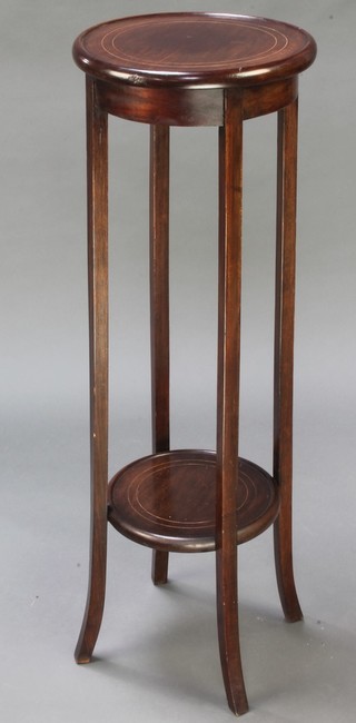 An Edwardian circular inlaid mahogany 2 tier jardiniere stand raised on out swept supports 38"h x 12 1/2" diam. 