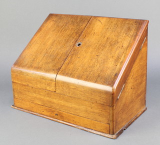 A Victorian wedge shape light oak stationery box with hinged lid and fitted interior, the base fitted a drawer 11"h x 14 1/2"w x 8 1/2"d
