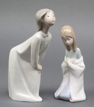 A Lladro figure of a kneeling girl 6", boxed, a ditto of child in a night dress 7" boxed 