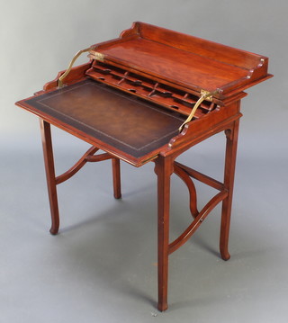 A 19th Century style mahogany writing table with cantilever top, the interior fitted pigeon holes with inset leather writing surface 31"h x 29"w x 17 1/2"d 