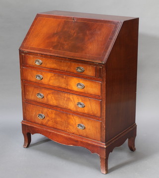 A Georgian style inlaid mahogany bureau, the fall front revealing a fitted interior above 4 long drawers with oval plated handles, raised on splayed feet 40"h x 29"w x 17 1/2" 