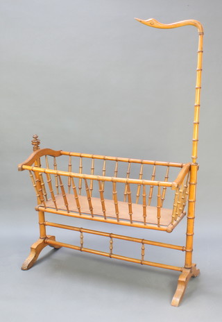 A Regency faux bamboo childs rocking crib with swan neck finial, 67"h x 43"w x 22"d 