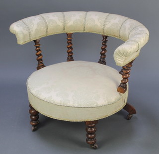 A Victorian mahogany tub back chair upholstered seat and back with spiral turned columns, raised on turned and column supports (frame loose)