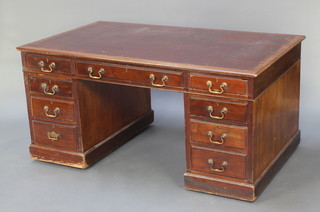 A Victorian mahogany kneehole pedestal desk with brown inset writing surface above 1 long and 8 short drawers 29"h x 60 1/2"w x 35 1/2"d 