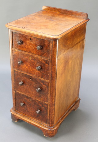 A Victorian figured walnut pedestal chest with raised back, the pedestal fitted 4 drawers with tore handles, raised on bracket feet 36"h x 17 1/2"w x 19"d 