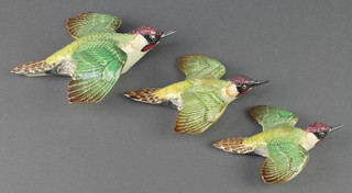 A set of Beswick Green Woodpecker wall plaques 1344/1/2/3 7 1/2", 6" and 5" 